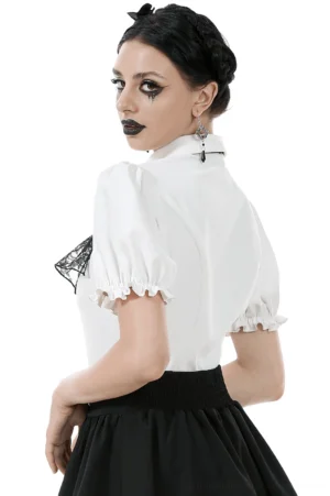 Back view of gothic white blouse with detachable lace jabot showing button closure and ruffled cuff details