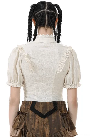 Victorian puff sleeve blouse back view showing lace shoulder trim and tailored waist on model with dark braided hair