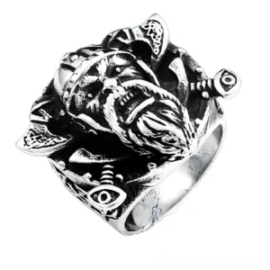 Viking gothic ring overhead side angle displaying high-relief carving with intricate eye pattern on band