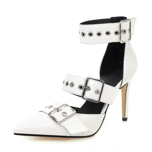 White and black color-block pointed toe stiletto heels with metal buckle hardware, gothic ankle strap shoes, side profile