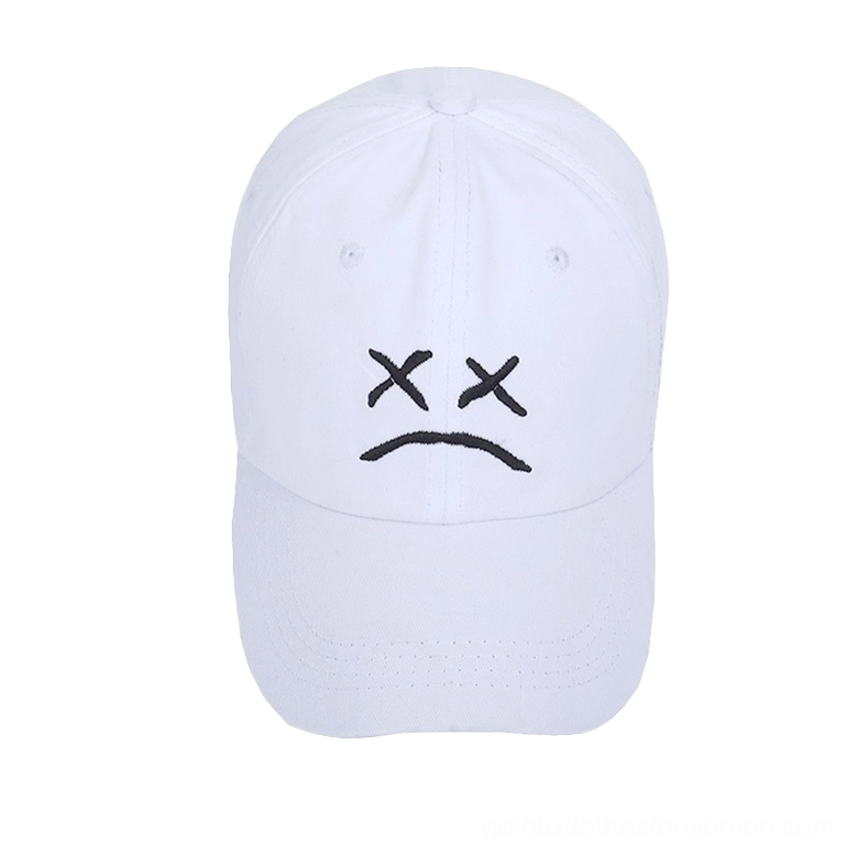White cotton gothic baseball cap with black embroidered crying face, dark aesthetic unisex design, frontal product shot