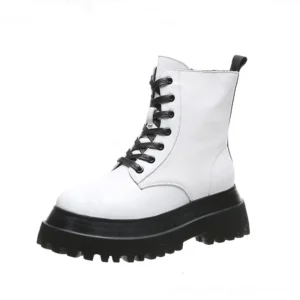 Two-tone white and black platform combat boots with side zipper, right side profile view showing contrast design and platform sole