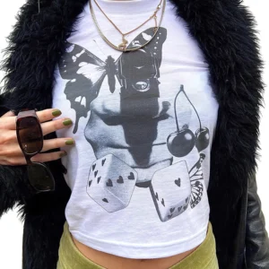 White butterfly print crop top styled with black faux fur jacket and sunglasses for gothic alternative outfit