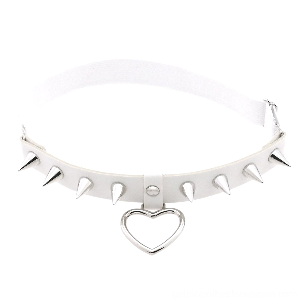 White PU leather leg garter with metallic spikes and hollow heart detail, studio flat lay product photography