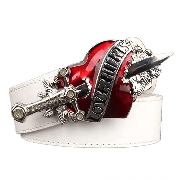 White gothic leather belt with decorative heart and dagger metal buckle, statement piece front view