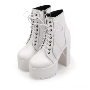 White platform ankle boots with thick sole and lace-up design, front-side elevated view
