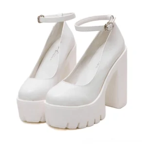 White gothic platform pumps with ankle buckle strap and soft faux leather, front three-quarter paired view