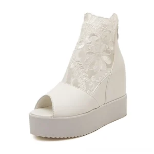 White gothic lace peep-toe wedge sandals with mesh floral upper and thick rubber platform sole, studio front view