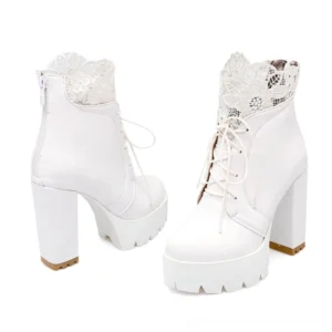 White lace-up gothic platform ankle boots with square heel, front paired view featuring white lace collar and architectural platform sole