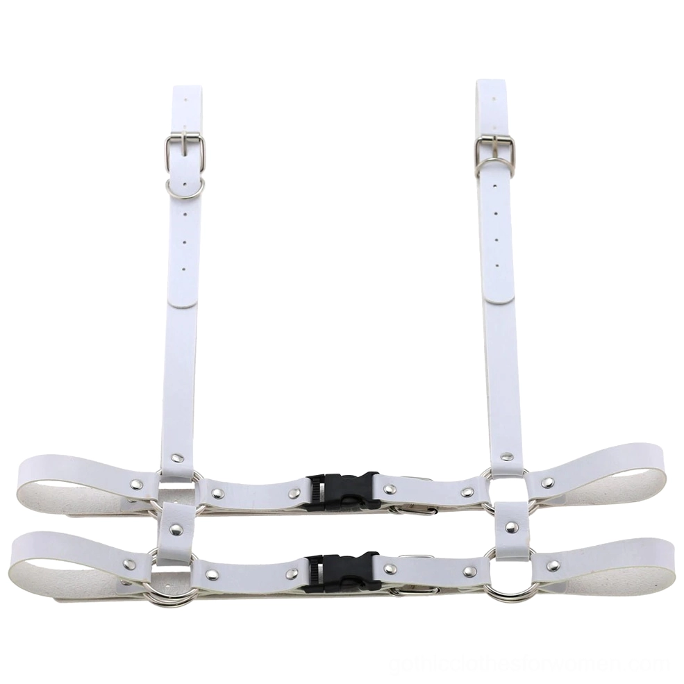 White leather body harness flat lay front view featuring geometric strap configuration and metal hardware accents