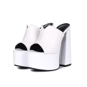 White genuine leather platform block heel mule sandal with open toe design, studio front view showcasing architectural heel structure