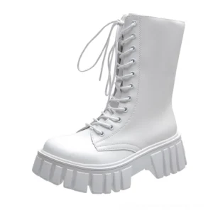 White platform lace-up gothic ankle boots featuring smooth leather upper and ridged sole on white background