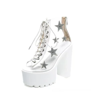 White star crystal transparent PVC lace-up platform boots with silver star embellishments and thick platform heel, side view
