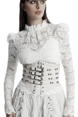 White studded underbust corset front view worn with vintage lace outfit on model, studio background