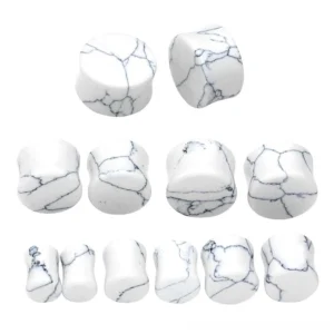 Single pair of white turquoise stone ear tunnel with natural marble texture and symmetric crack pattern detail