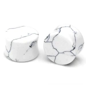 White turquoise marble stone ear gauges with black veining, double flared design shown from front and side angles in studio lighting