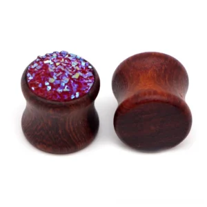 Wine red bamboo wood ear gauges with iridescent resin inlay, double-flared tunnel expander design, front view on white background