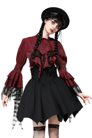 wine red gothic blouse front view with lace ruffle detail and bell sleeves on model with twin braids