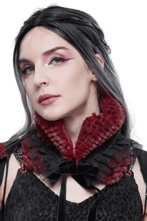 Burgundy faux fur gothic neck collar with black lace bow on female goth model, front view studio portrait
