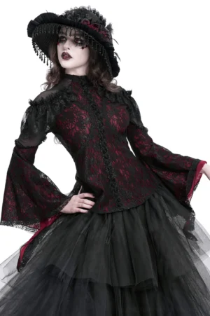 Wine red Victorian gothic cold shoulder lace blouse with dramatic bell sleeves, sheer mesh panels, and floral lace overlay - front three-quarter view worn by model