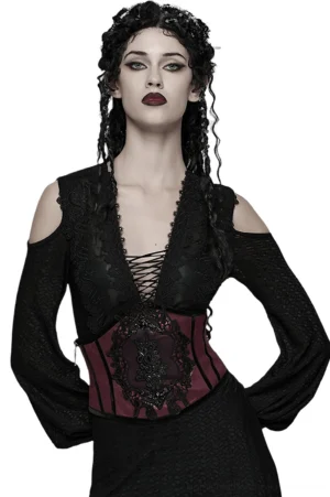 Wine red gothic corset belt with black embroidered lace applique worn by female goth model in front full portrait view on white studio background