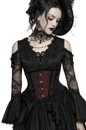 Model wearing wine red gothic underbust corset styled with black lace off-shoulder top, choker, and gothic accessories for complete alternative fashion look