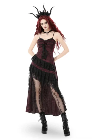 Wine red gothic asymmetric maxi dress with black lace ruffles and rose corsage, front three-quarter view on model with crimson hair