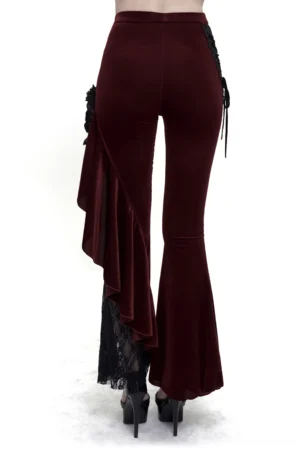 Back view of wine red gothic trousers showcasing ruffled lace panels and side details