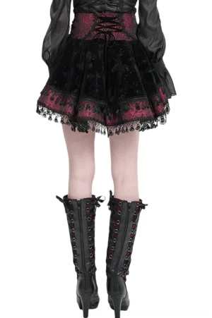 Gothic velvet skirt back view showing high-waisted lace-up corset waist and lace trim hem