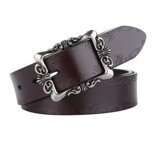 Wine red vintage leather belt with ornamental gothic buckle, 3/4 overhead view