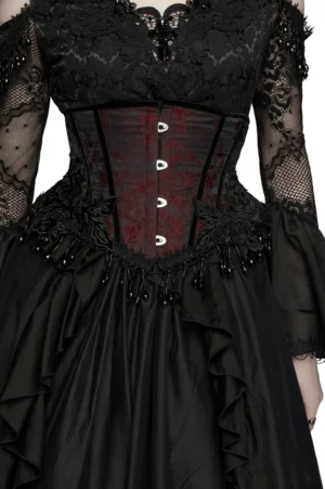 Wine red jacquard gothic underbust corset with beaded fringe detail, close-up front view showing rose appliques and black lace trim