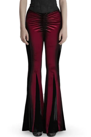 Wine red gradient velvet gothic flared pants front view on model showing pleat detail and slim fit silhouette
