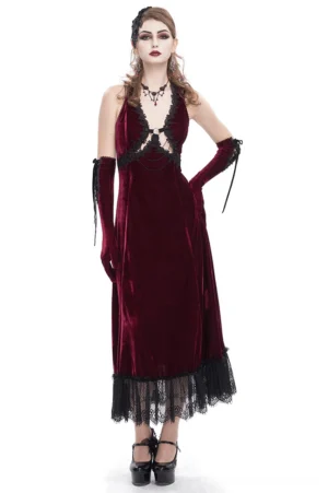 Wine red velvet gothic maxi dress with black lace hem and cutout detail, front full-body view on model with long black gloves