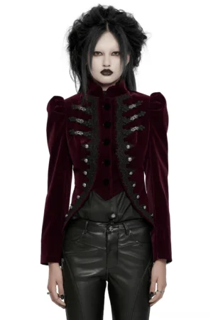 Wine red velvet gothic jacket with lace-up corset back, worn by female goth model in studio, full-body front view showing puff sleeves and ornate button details