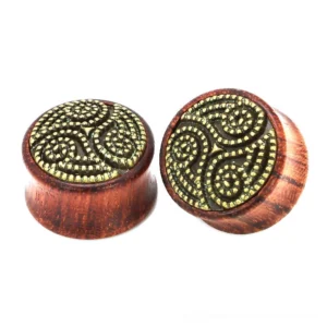 Wine red wooden ear gauge with triskele Celtic metal inlay, front view showing natural wood grain and burgundy finish, gothic body jewelry for ear stretching