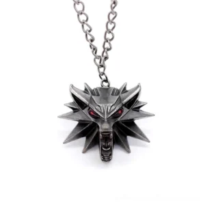 Wolf head pendant necklace with vibrant red painted eyes, front view displaying metal link chain and full pendant design against white background