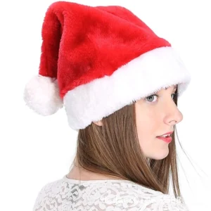 Close-up side profile of woman wearing luxurious plush Santa hat, showcasing soft velour fabric and white fleece trim detail