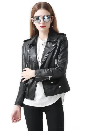 Women's black sheepskin leather motorcycle jacket with standing collar and asymmetrical zipper, worn by model with aviator sunglasses, front view