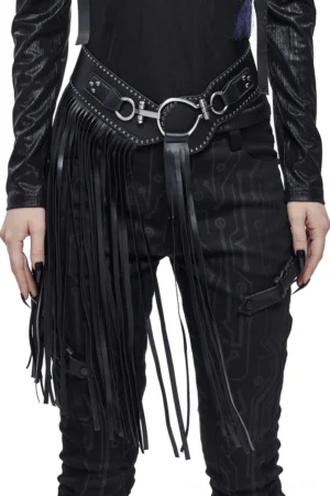 Women's gothic tassel leather belt front three-quarter view on model wearing black alternative fashion outfit with metal O-ring buckles and long side fringe