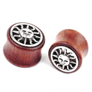 Close-up detail view of bamboo wood ear tunnel with intricate sun design and wine-red finish