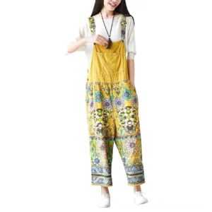 Yellow psychedelic floral wide-leg gothic pants front view with ethnic botanical print and side pockets