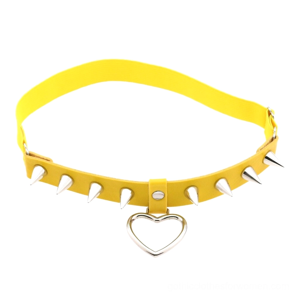 Yellow elastic gothic leg garter belt with silver spikes and heart charm, bold alternative fashion statement