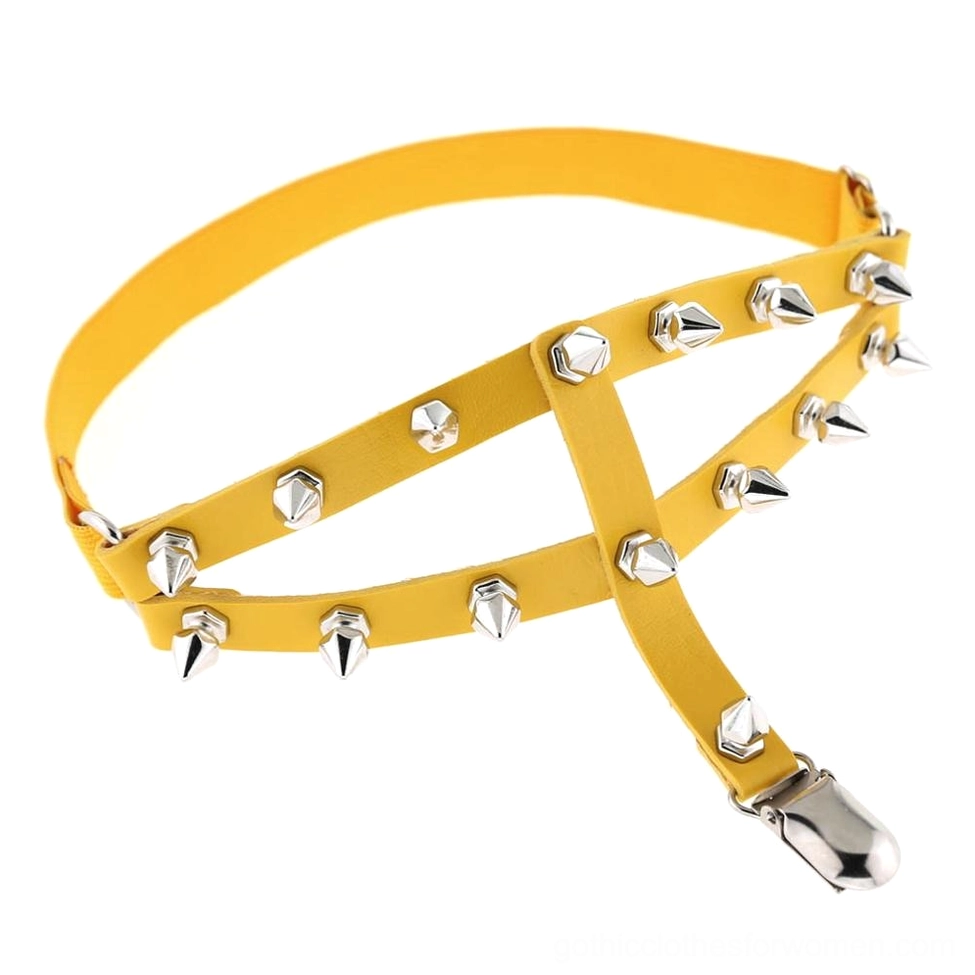 Yellow spiked thigh garter with silver pyramid studs and adjustable cross strap construction